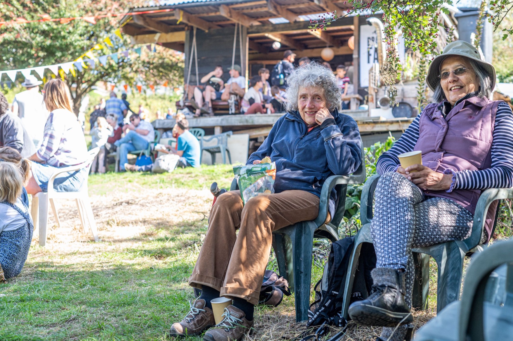 People relaxing at a community garden event